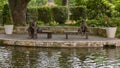 Bronze sculpture of a boy and old man fishing by Gary Price at the Dallas Arboretum and Botanical Garden Royalty Free Stock Photo