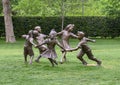 Bronze sculpture of children holding hands running in a circle by Gary Price at the Dallas Arboretum and Botanical Garden