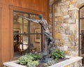 Bronze sculpture of a cowboy outside an art store in Vail, Colorado.