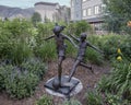 `Soccer Kids`, a bronze sculpture by Dennis Smith in Avon, Colorado. Royalty Free Stock Photo