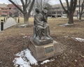 Bronze sculpture depicting St. Joseph teaching the young Jesus located outside on the campus of Creighton University.