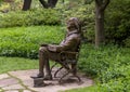 Pictured is a bronze sculpture featuring Benjamin Franklin on a bench in Turtle Creek Park in Dallas, Texas.