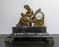 Bronze lady and clock sculpture at the Riad Maison Bleue, a luxury boutique hotel in in Fes, Morocco.