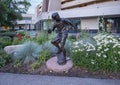 `Sidewalk Society, Ollie`, a bronze sculpture by Glenna Goodacre in Avon, Colorado. Royalty Free Stock Photo