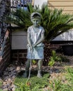 `Future Golf Champ` featuring a young girl by sculptor Randolph Rose on display in front of a home in Jefferson, Texas.