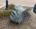 Bronze sculpture titled \'Face Fragment II\' by Susan Evans in downtown Edmond, Oklahoma.