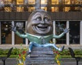 Bronze sculpture titled `Humpty Dumpty - Eggcitement` by Kimber Fiebiger at the Richardson Library Reading Garden.