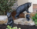 Bronze sculptures of a mother black bear and her cubs in Beaver Creek, Colorado.