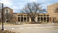 A building on the campus of the University of North Texas with a sign featuring the Eagle mascot for it`s sports teams.