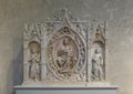 Altarpiece of Carrara marble by Andrea da Giona on display in the Cloisters in New York City.