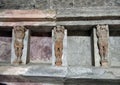 Carved figures and niches where bath supplies stored in bathhouse remains, Scavi Di Pompei