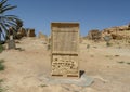 Carved stone information plaque for Gebel Al Mawta, the `Mountain of the Dead`, in Siwa Oasis, Egypt.