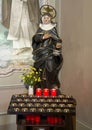 Carved wooden polychrome statue of Saint Martha in the Church of Saint Martha in Menaggio on Lake Como.