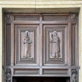 Carved wooden reliefs of Saint Francis and Saint Clare of Assisi at the Papal Basilica of Saint Mary of the Angels.