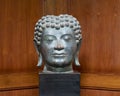 Cast bronze buddha head on public display in a resort on the island of Maui in the state of Hawaii.