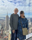 Caucasian husband and Korean wife posing in the immersive art experience of SUMMIT One Vanderbilt in New York City. Royalty Free Stock Photo