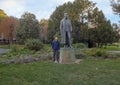 Tourist by Bronze statue Emperor Francis Joseph I of Austria, Burggarten Park, Vienna