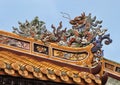 Chinese dragon atop a building in the Tu Duc Royal Tomb complex, Hue, Vietnam