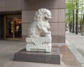 White marble male guardian lion at entrance to the Crow Museum of Asian Art in downtown Dallas, Texas
