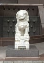 White marble male guardian lion at entrance to the Crow Museum of Asian Art in downtown Dallas, Texas