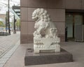 White marble female guardian lion at entrance to the Crow Museum of Asian Art in downtown Dallas, Texas