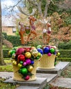 Christmas display with Reindeer atop pedestals adorned with large Christmas bulbs in Dallas, Texas