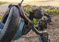 Backyard Adventure by Missy Vandable, bronze sculpture in Edmond, Oklahoma