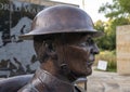 Closeup profile view of the head of an Army infantry statue in the Veteran`s Memorial Park in the City of Irving, Texas.