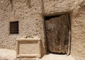 Closeup view of an entrance door with sign for the Old mosque of Shali Fortress in the Siwa Oasis, Egypt.