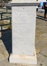 Information on pedestal of sculpture of Saint Margherite of Antioch, patron saint of the city of Santa Margherita Ligure, Italy