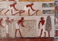 Closeup view of the end portion of the fresco in TT69 with Menna seated overseeing crop measurement and field work.