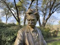 Closeup view of a portion of the bronze Mark Twain II sculpture by Gary Lee Price at the Dallas Arboretum in 2023.