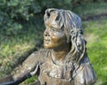 Closeup view of a portion of the bronze Mark Twain II sculpture by Gary Lee Price at the Dallas Arboretum in 2023. Royalty Free Stock Photo