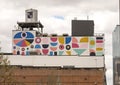 Large mural that wraps around a renovated building at 2200 Main Street in Dallas, Texas.