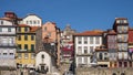 Colorful dwellings and the Capela de Nossa Senhora de O along the Douro River in the Ribeira neighborhood of Porto, Portugal.