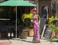 Day of the Dead skeleton holding a margarita and wearing women's clothing outside a restaurant in Todo Santos.