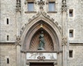 Detail of the secondary entrance of Basilica de Santa Maria del Mar with Saint Mary surrounded by a pointed arch, Barcelona, Spain