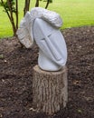 Dolomite marble sculpture titled Daydreaming by Zachariah Nuobo in the Fort Worth Botanic Garden.