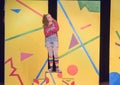 Eleven-year old girl standing on stage in school play Royalty Free Stock Photo