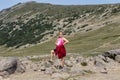 Eleven year-old Caucasian girl standing proudly along a trail in Mount Rainier National Park, Washington