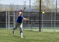 Girl softball pitcher warming up before a game