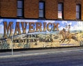 Exterior mural by Western artist Stylle Read, on the side of the building that houses Maverick Fine Western Wear