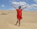 Female Korean tourist in the eastern part area of the Great Sand Sea near the Siwa Oasis in Egypt.