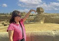 Female Korean tourist and The Great Sphinx of Giza, on the Giza Plateau in Giza, Egypt.
