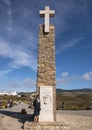 Korean tournist by Monument to Cabo da Roca being the westernmost point of Europe, on the Atlantic Ocean in Portugal.