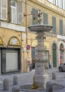 Fountain with child drinking from a shell in Genoa, northern Italy