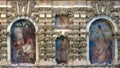 Four of several frescoes by Diego Esquivel in the textured wall behind the Mercury pond in the gardens of Real Alcazar in Seville.