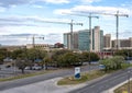 Four large cranes on construction project Southwestern Medical District in Dallas, Texas