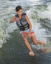 Fourteen year-old Amerasian boy taking a spill while wake surfing on Grand Lake in Oklahoma.