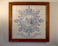Framed mosaic tile featuring the Pasteis de Belem founding in 1837 in Lisbon, Portugal. Royalty Free Stock Photo